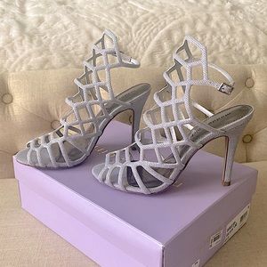 Beautiful Silver High Heel Shoes from MACY’S. Size 8.5 very comfotable.
